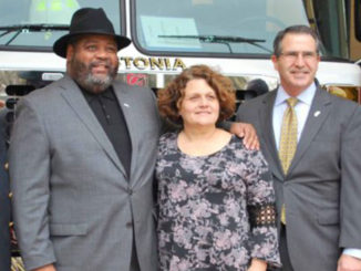 Fire chief, mayor and three city council members in front of new fire truck