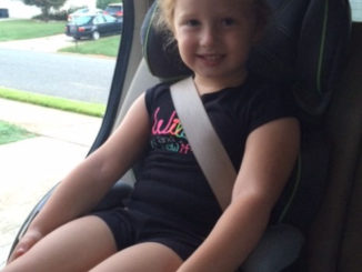 Older child in forward-facing car seat