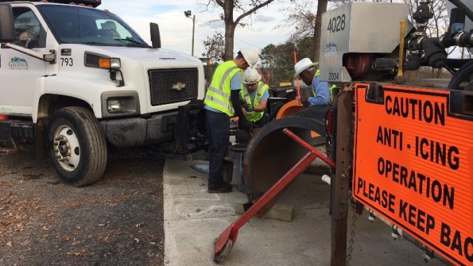 Crews attach snowplow to City of Gastonia truck