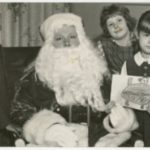 Santa and three children at Loray Mill