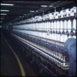 Hundreds of spools of white thread at Firestone plant
