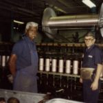 Two men working at Firestone plant