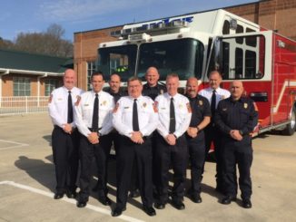 Nine Gastonia firefighters in front of fire truck