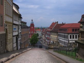 Old buildings, cobblestone streets, church steeple in Gotha, Germany