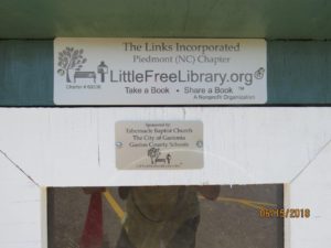 Plaques identifying as a Little Free Library