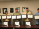 Five men holding framed certificates