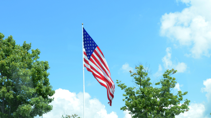 American flag against blue sky