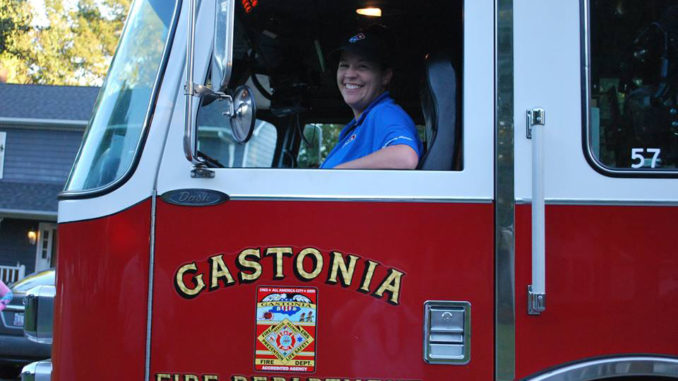 Fire truck driver smiles for the camera
