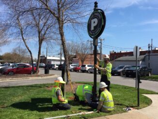 Downtown parking sign installation