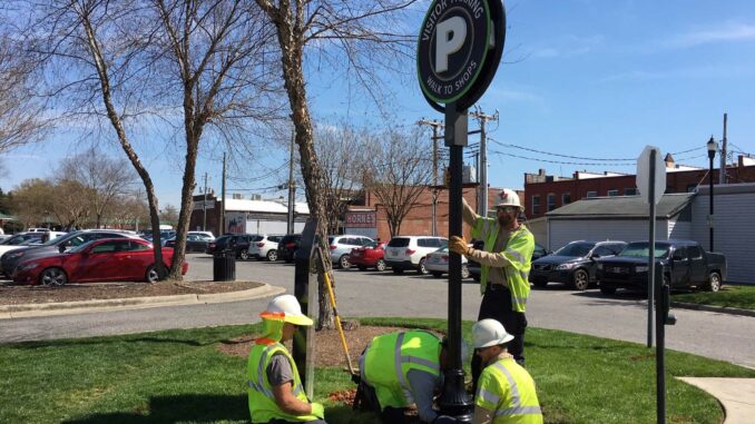 Downtown parking sign installation