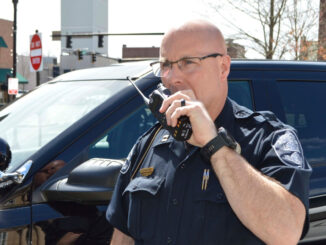 Police officer talking on portable radio