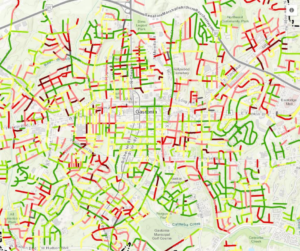 Map of city street marked in red, pink, yellow and green