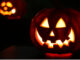 Pumpkins carved as jack-o-lanterns.