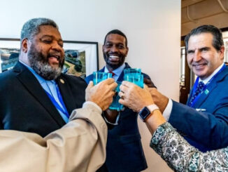 City leaders give a toast with glasses of water