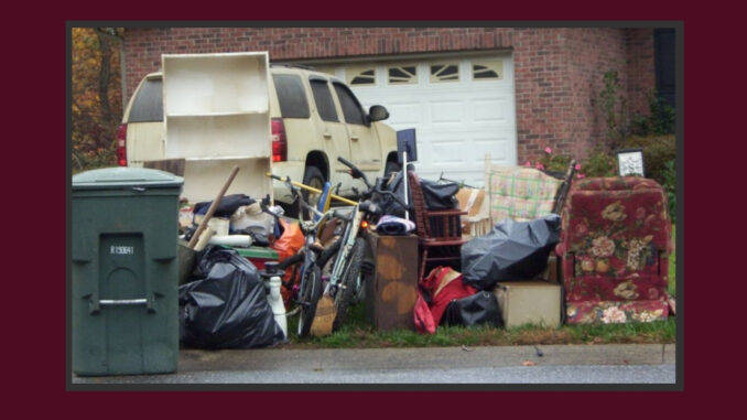 Furniture and other trash piled at the curb