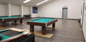 Pool tables in room with new flooring