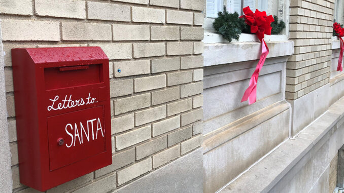 Red mailbox that says Letters to Santa at City Hall