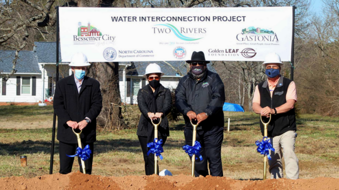 Four officials with ceremonial shovels