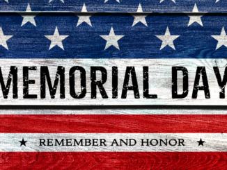 American flag painted on wood with words "Memorial Day"