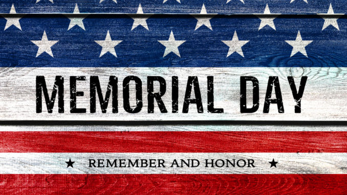 American flag painted on wood with words "Memorial Day"